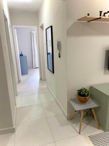 Apartamento no centro, ar-condicionado e garagem
