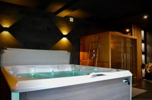 Appartements La Charmeraie Wellness & SPA : photos des chambres