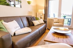 Terrasse, gratis Nutzung vom AHOI Erlebnisbad und Sauna in Sellin - Meeresblick FeWo 12