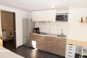 Appartements Studio 002 neuf proche gare TGV, A36 et Hopital : photos des chambres