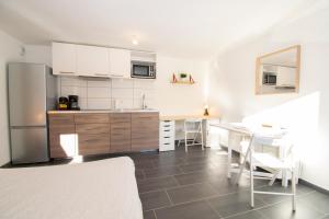 Appartements Studio 002 neuf proche gare TGV, A36 et Hopital : photos des chambres