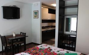 Studio room in Apartments Logos