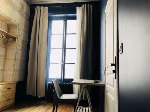 Appartements Meubles de l'Arsenal coeur de ville ! : photos des chambres