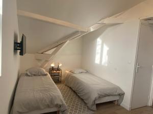 Appartements Studio dans les ecuries du chateau : photos des chambres