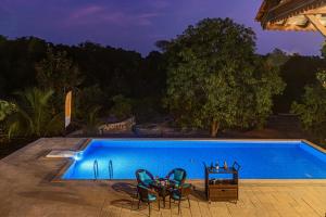 SaffronStays Vedika - 4BR riverfront pool villa with kaya king bullock ride & BBQ near Pinjal River, Vikramgad
