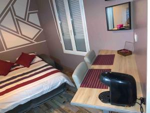 Appartements Le Petit Toulouse : photos des chambres