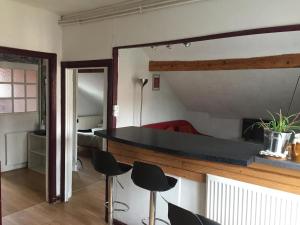 Appartements Sous Les TOITS ARVERNE : photos des chambres