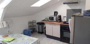 Appartements L'appartement du Jardin Perdoux : photos des chambres