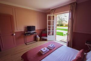 B&B / Chambres d'hotes Les jardins de Beaumont : photos des chambres