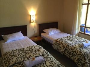 Phòng 2 Giường Đơn Nhìn Ra Khu Vườn (Twin Room with Garden View)