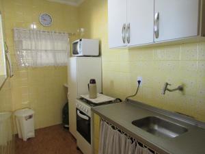 Apto pé na areia com vista para o mar e Wifi