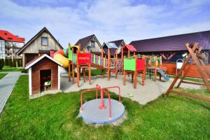Holiday home in Ustronie Morskie with a playground