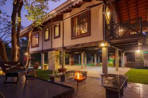 Aranyam Villa by StayVista with Modern wooden interiors, Kidszone, Indoor games & plunge pool
