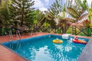 Aranyam Villa by StayVista with Modern wooden interiors, Kidszone, Indoor games & plunge pool