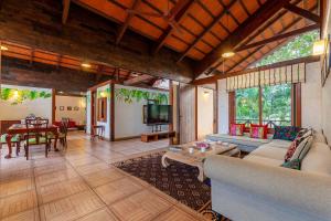 Aranyam Villa by StayVista with Modern wooden interiors, Kidszone, Indoor games & plunge pool