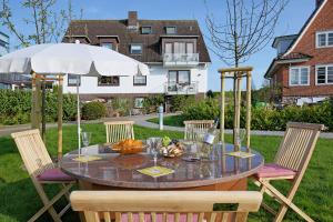 Büngers Apartment-Hotel mit Gartensauna - modern, gemütlich und strandnah