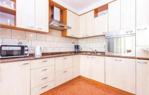 Awesome Apartment In Novi Vinodolski With Kitchen