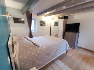 Appartements Le rez de jardin : photos des chambres