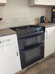 BJ Chalets - De Rug 1 - Vakantiepark Lauwersoog - LUXE chalet met vaatwasser! Vroege incheck!