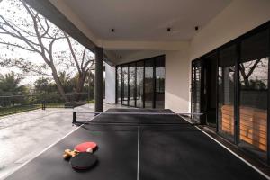 Earth Song by StayVista - Boasting an Open theatre, Games, Spacious lawn, Swimming pool & Conference room