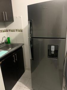 Casa amplia cerca del cc Titan Plaza