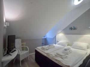 Dünenpark Binz - Komfortplus Ferienwohnung mit 1 Schlafzimmer und Balkon im Dachgeschoss 022