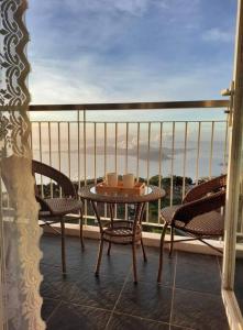 1 BR Cozy Farmhouse-Style Condo with Balcony & Taal View at Wind Residences