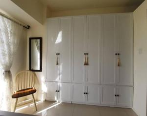 1 BR Cozy Farmhouse-Style Condo with Balcony & Taal View at Wind Residences