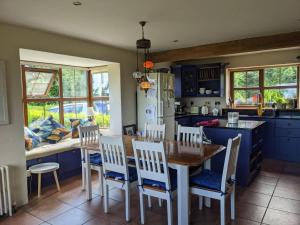 Large ensuite superking bedroom with swilly views
