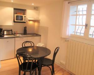 Appartements Cosy studio au coeur du triangle d'or : photos des chambres