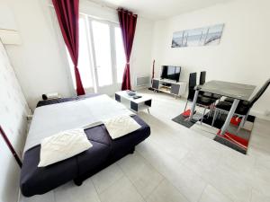 Appartements Le MyHolidee - Rue Pietonne - Plage a 200m : photos des chambres