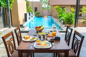 SaffronStays Eden - 3BR vineyard-side pool villa with jacuzzi, farm dining, stargazing deck & lawns for celebrations