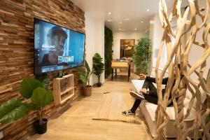 Appartements Capsule Thailande I Sauna I Balneo I Console I jeux en bois I Cinema I cour interieure : photos des chambres