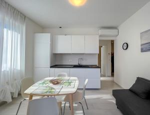 NUOVO BILOCALE IN CENTRO CON TERRAZZO E POSTO AUTO