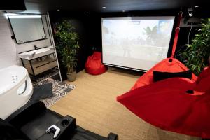 Appartements Capsule movie avec Balneo home cinema playstation 5 : photos des chambres