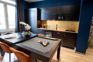 Appartements Capsule Temps suspendu - balneo, home cinema & billard : photos des chambres