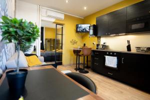 Appartements Capsule Premium balneo & home cinema : photos des chambres
