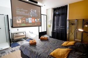 Appartements Capsule Premium balneo & home cinema : photos des chambres