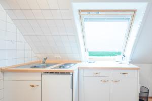 Direkt am Deich - Ferienwohnung Oland im Gästehaus Am Badedeich