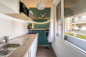 Appartements studio cosy proche du centre + parking gratuit : photos des chambres