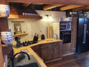 Chalets Cosy Lodge au pied de l'Alpe D'Huez Sport et Detente Jacuzzi Piscine Sauna Bar Billard : photos des chambres