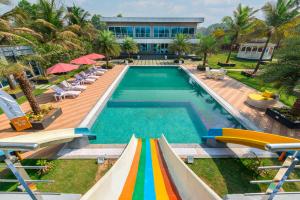 SaffronStays Palm Paradise, Kalyan Khadavli - swimming pool with water slides, gazebo and indoor games