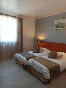 Hotels Hotel Restaurant Miramar L'orchidee : Chambre Lits Jumeaux - Vue sur Cour