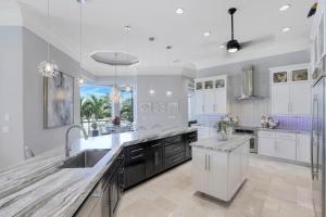 Waterfront home with infinity pool, spa and outdoor TV