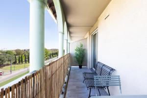 Appartements T2 climatise avec piscine au pied du tram arenes romaines : photos des chambres