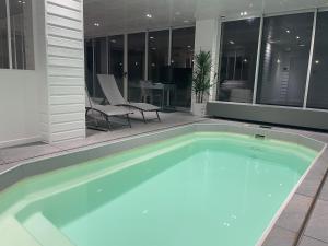 Appartements Le Loft Mauresque Centre Ville piscine privee interieure chauffee : photos des chambres