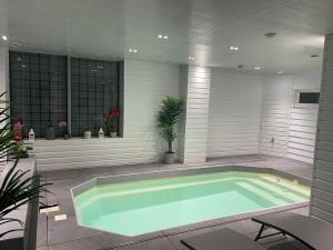 Appartements Le Loft Mauresque Centre Ville piscine privee interieure chauffee : photos des chambres