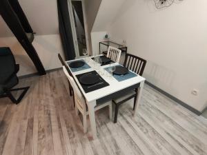 Appartements LA MACHINE Sous Combles : photos des chambres