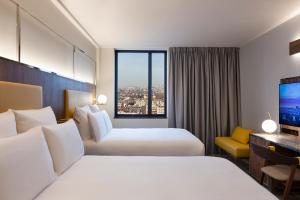 Deluxe Premium Family Twin Room with Two Communicating Room and City View room in Pullman Paris Montparnasse