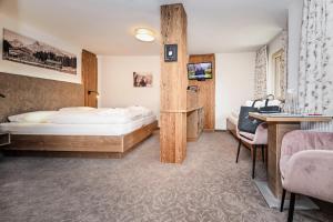 Triple Room with Balcony room in Hotel Alpenfeuer Montafon